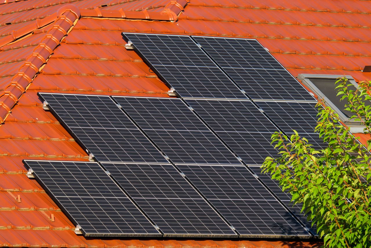 services-01 Close-up of solar panels on a red tiled roof in Croatia, highlighting renewable energy.